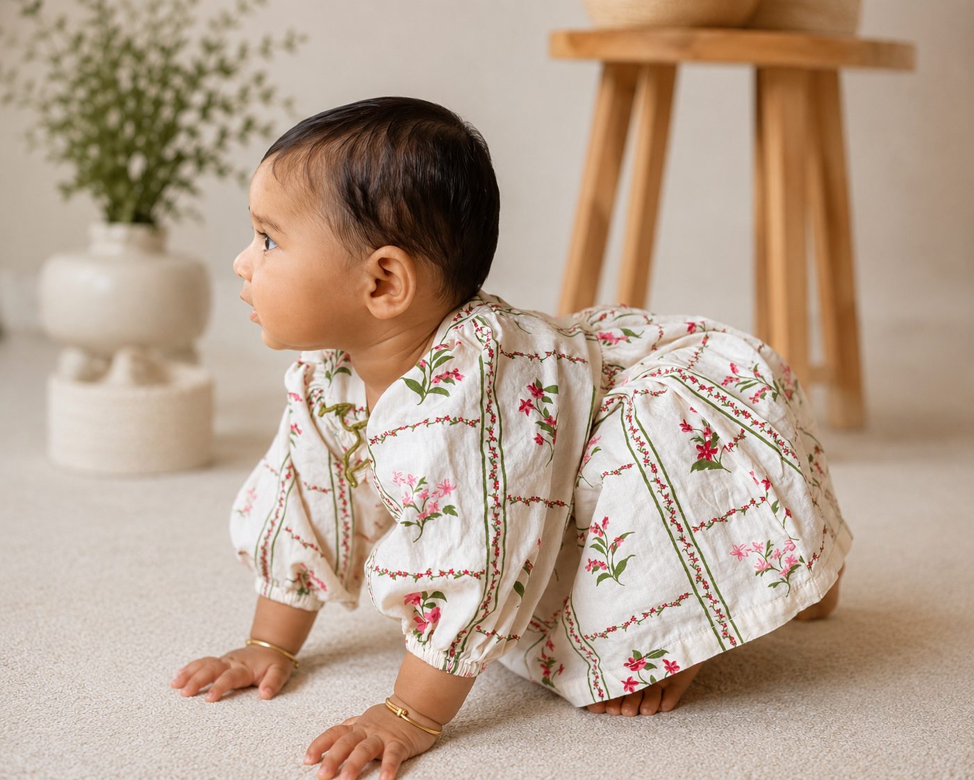 Baby crawling in a Threads & Todds vineyard print dress